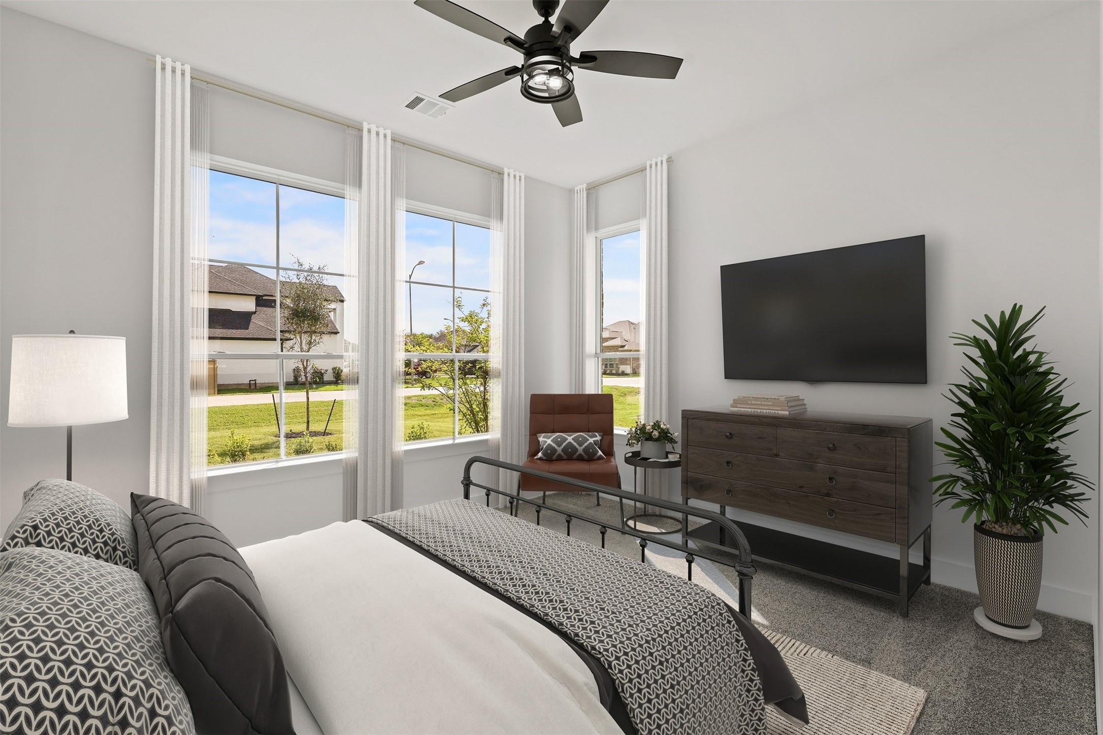 3607 Wellborn Drive Fulshear, TX 77441 - Photo 19 of 27 a bedroom with a bed a large window and flat screen tv