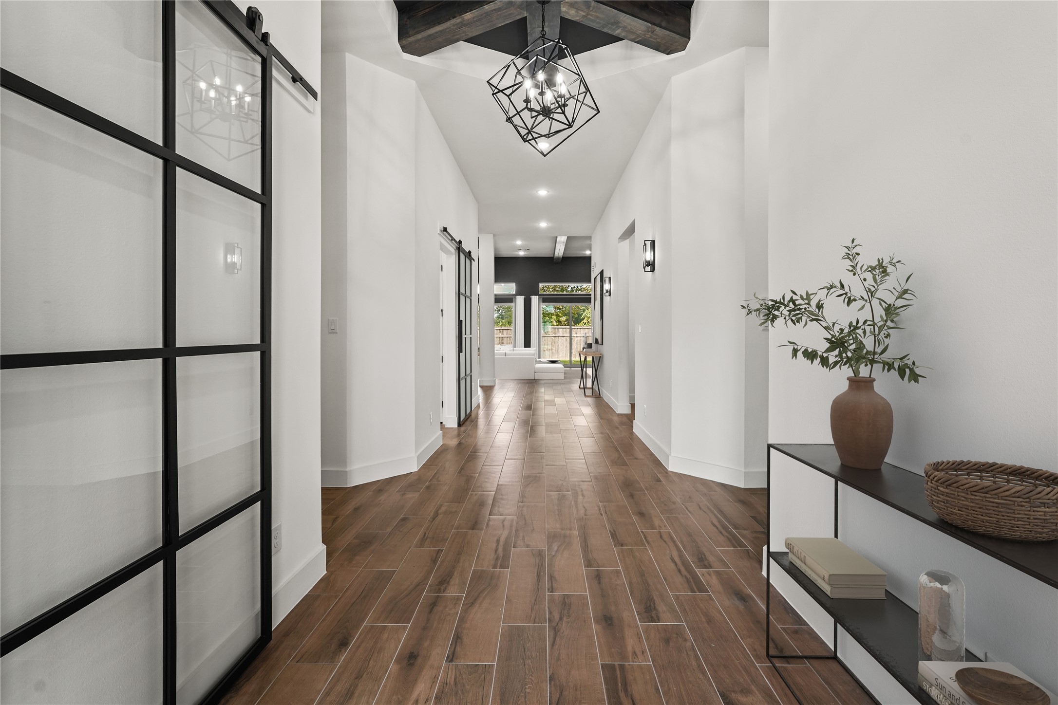 3607 Wellborn Drive Fulshear, TX 77441 - Photo 3 of 27 a view of a hallway with wooden floor
