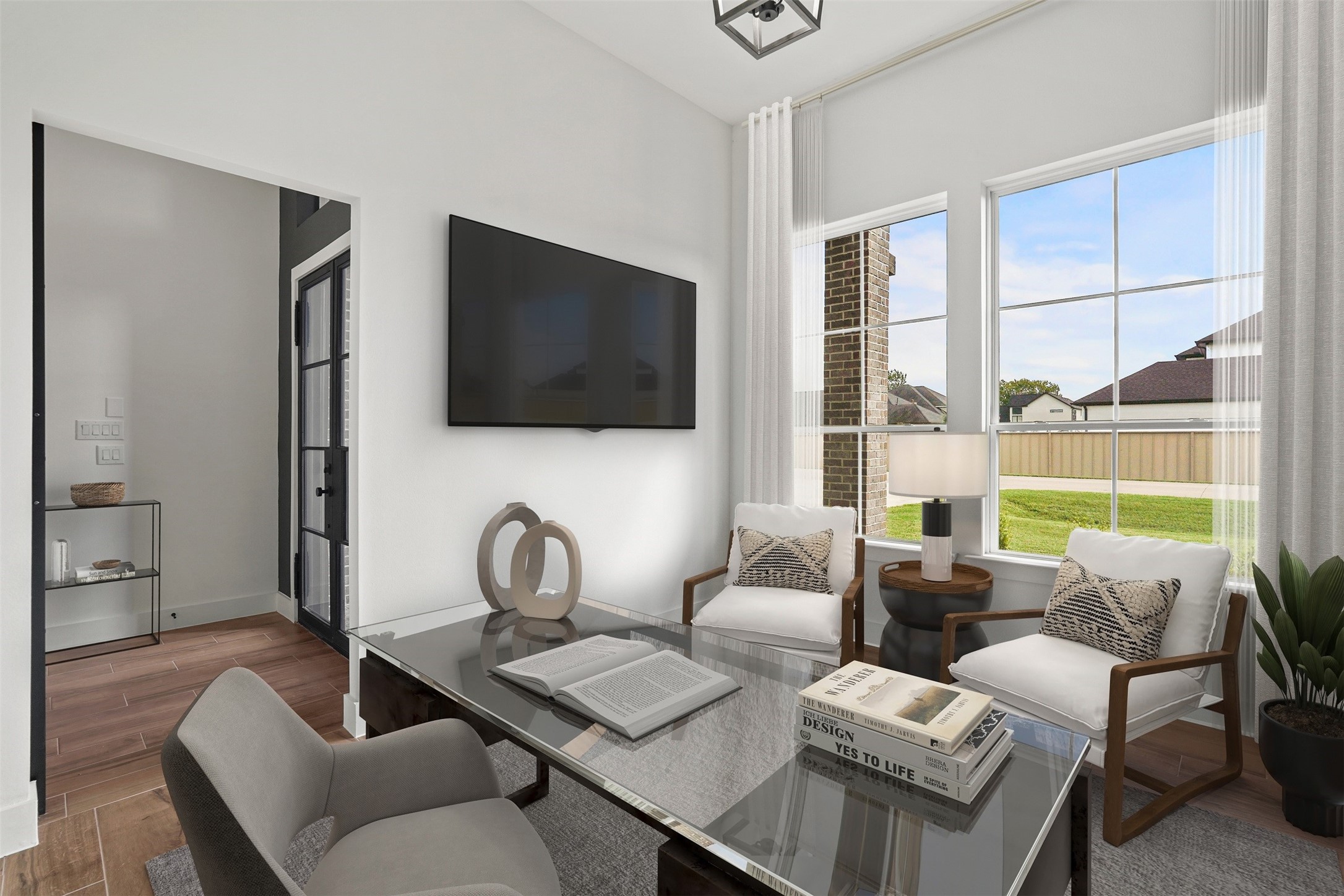3607 Wellborn Drive Fulshear, TX 77441 - Photo 4 of 27 a living room with furniture a flat screen tv and a window