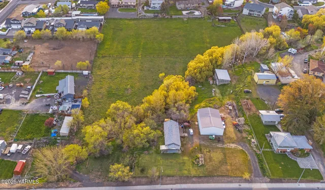 an aerial view of a house with a lake view