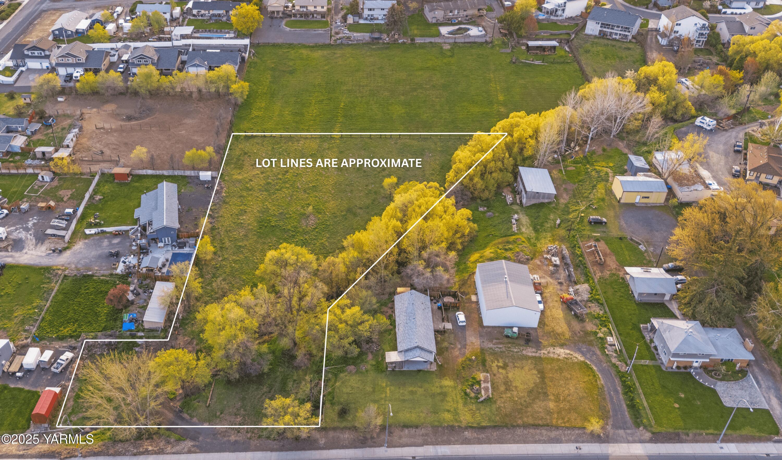 980 Selah Loop Road Selah, WA 98942 - Photo 2 of 7 an aerial view of residential houses with outdoor space