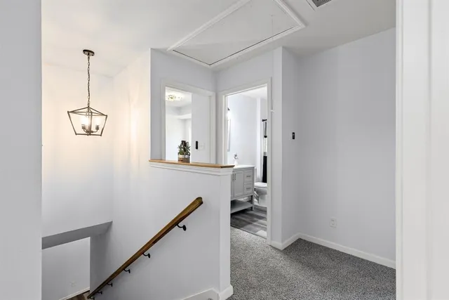 a view of a hallway with a room