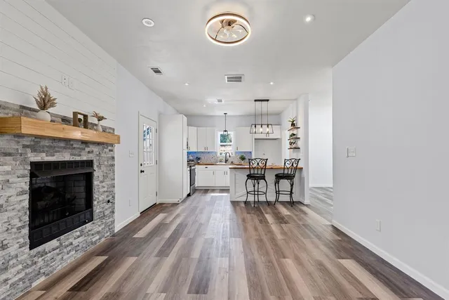 a view of kitchen with furniture and wooden floor