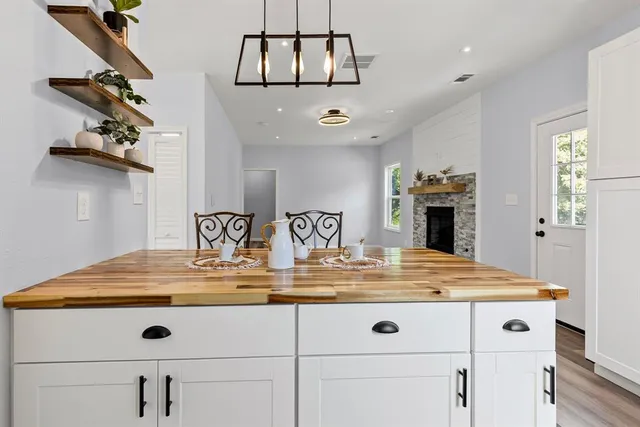 a view of kitchen countertops with wooden floor