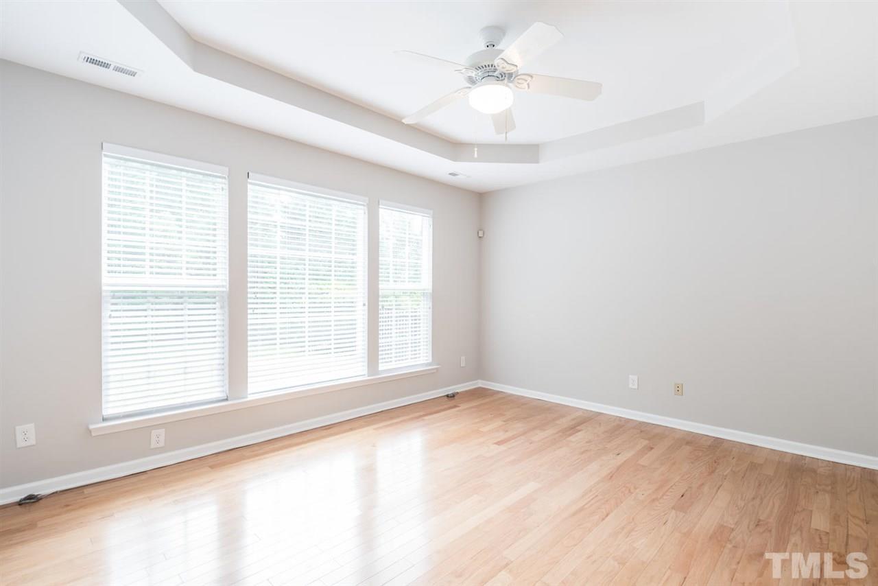 3406 Blessing House Street Raleigh, NC 27614 - Photo 14 of 23 an empty room with a window and a ceiling fan