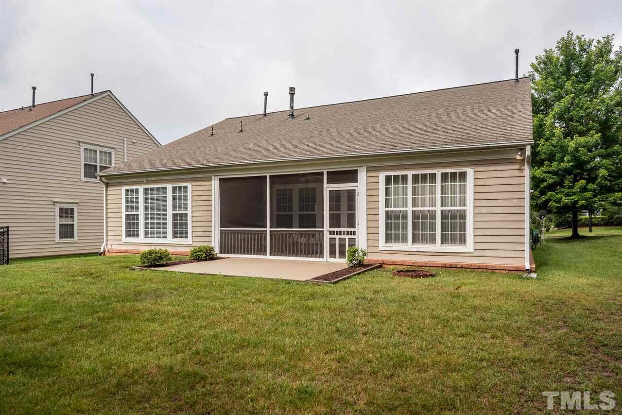 3406 Blessing House Street Raleigh, NC 27614 - Photo 22 of 23 a view of a house with a yard and sitting area