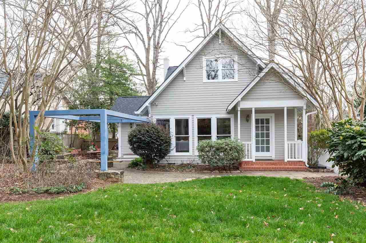 2119 Cowper Drive Raleigh, NC 27608 - Photo 21 of 30 Nicely landscaped w/private fenced backyard w/huge stacked-stone walled paver Patio, double swing, and water fountain feature Exterior Back