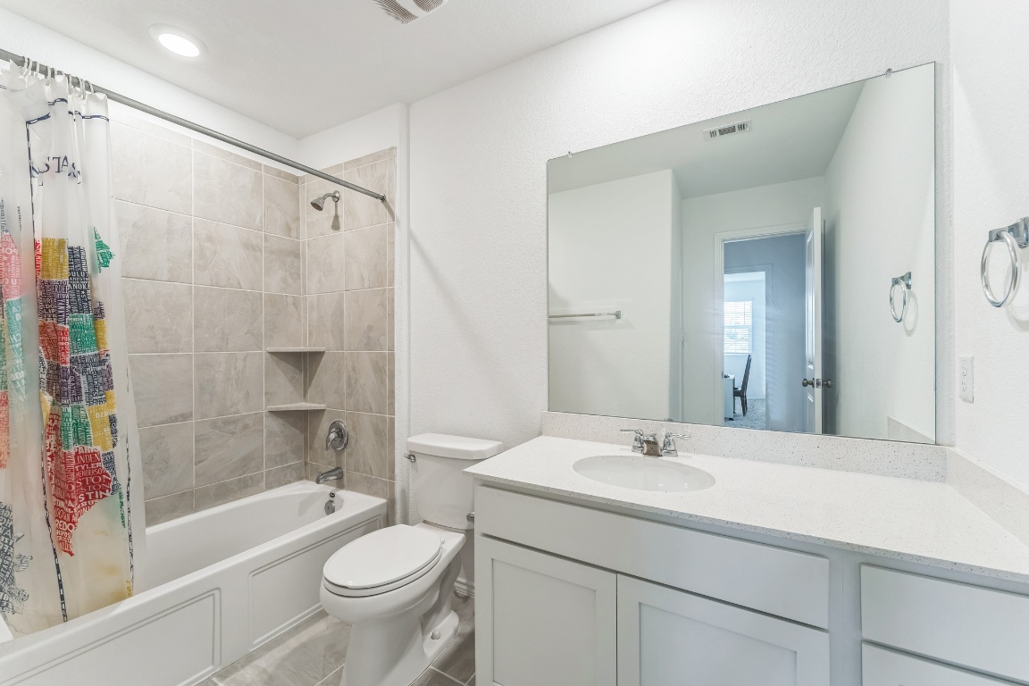 133 Cherry Ridge Road Georgetown, TX 78628 - Photo 25 of 30 a bathroom with a sink toilet and shower