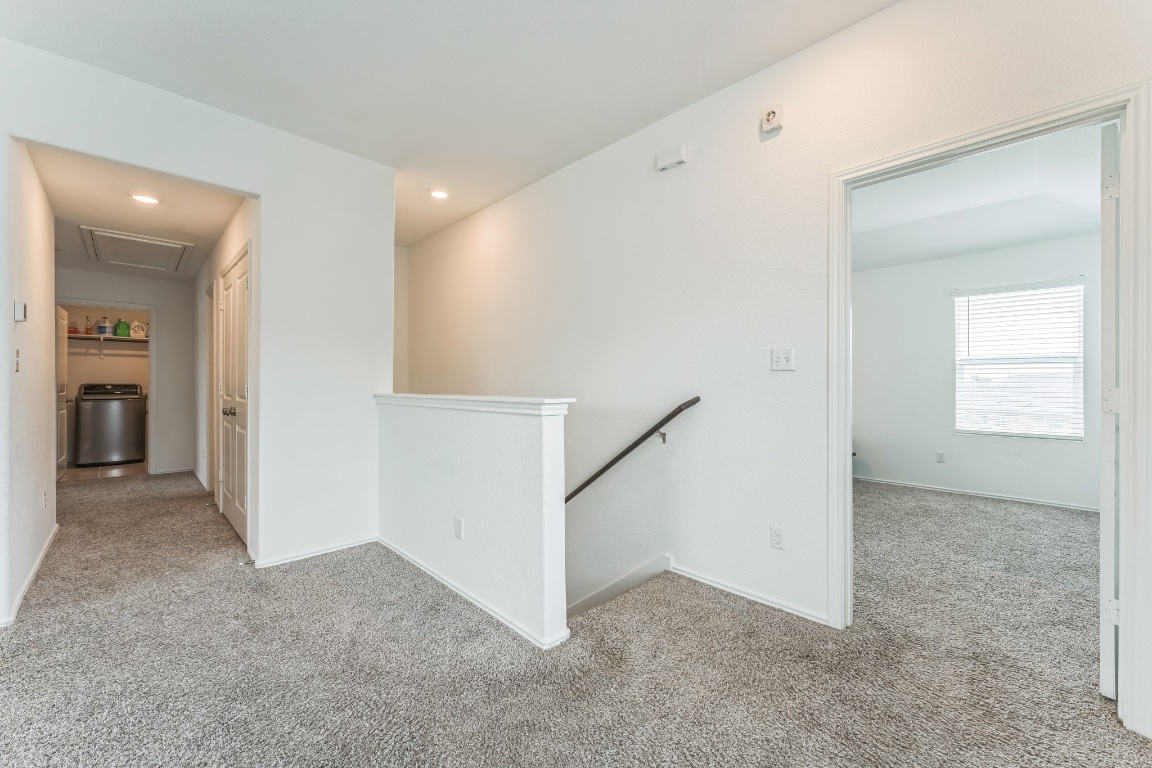 133 Cherry Ridge Road Georgetown, TX 78628 - Photo 29 of 30 an empty room with windows and entrance to other room