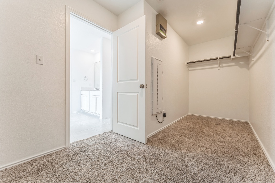 133 Cherry Ridge Road Georgetown, TX 78628 - Photo 6 of 30 an empty room with white cabinet and glass door