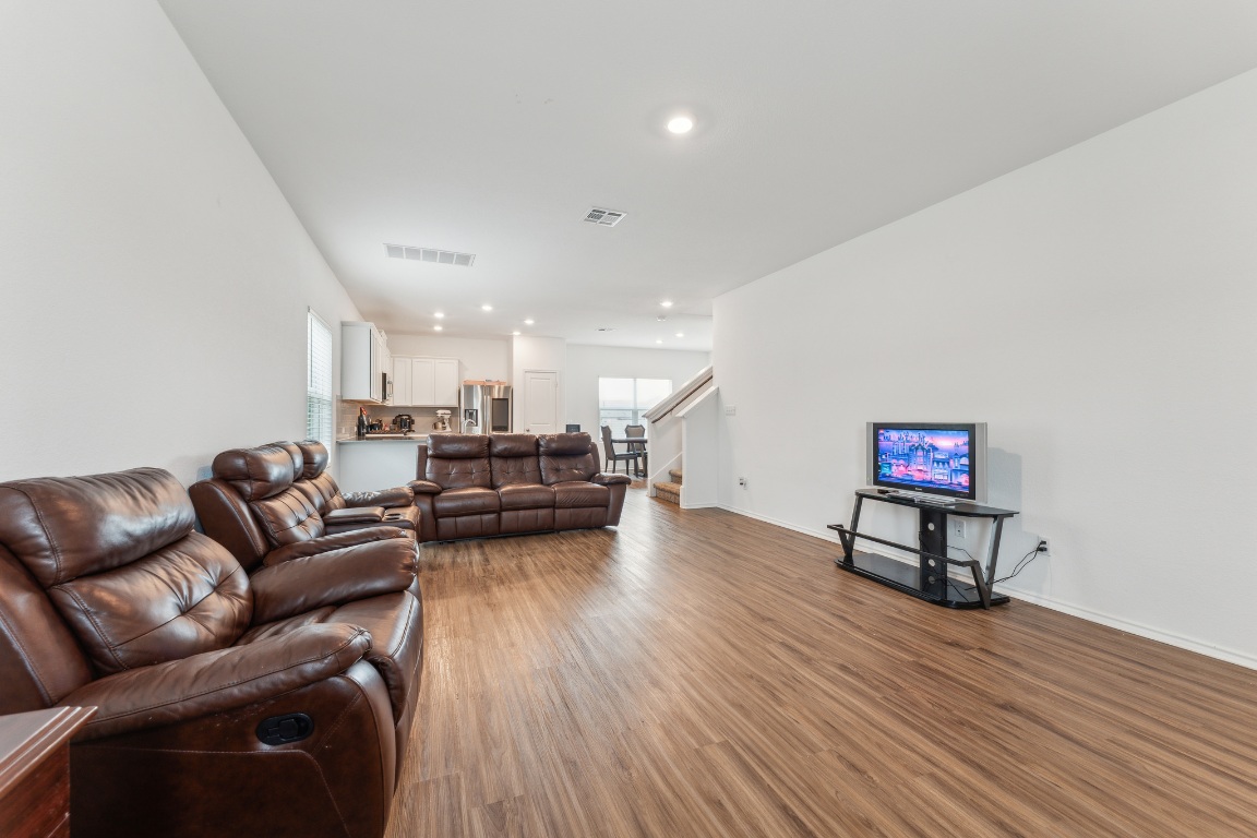 133 Cherry Ridge Road Georgetown, TX 78628 - Photo 7 of 30 a living room with furniture and a wooden floor
