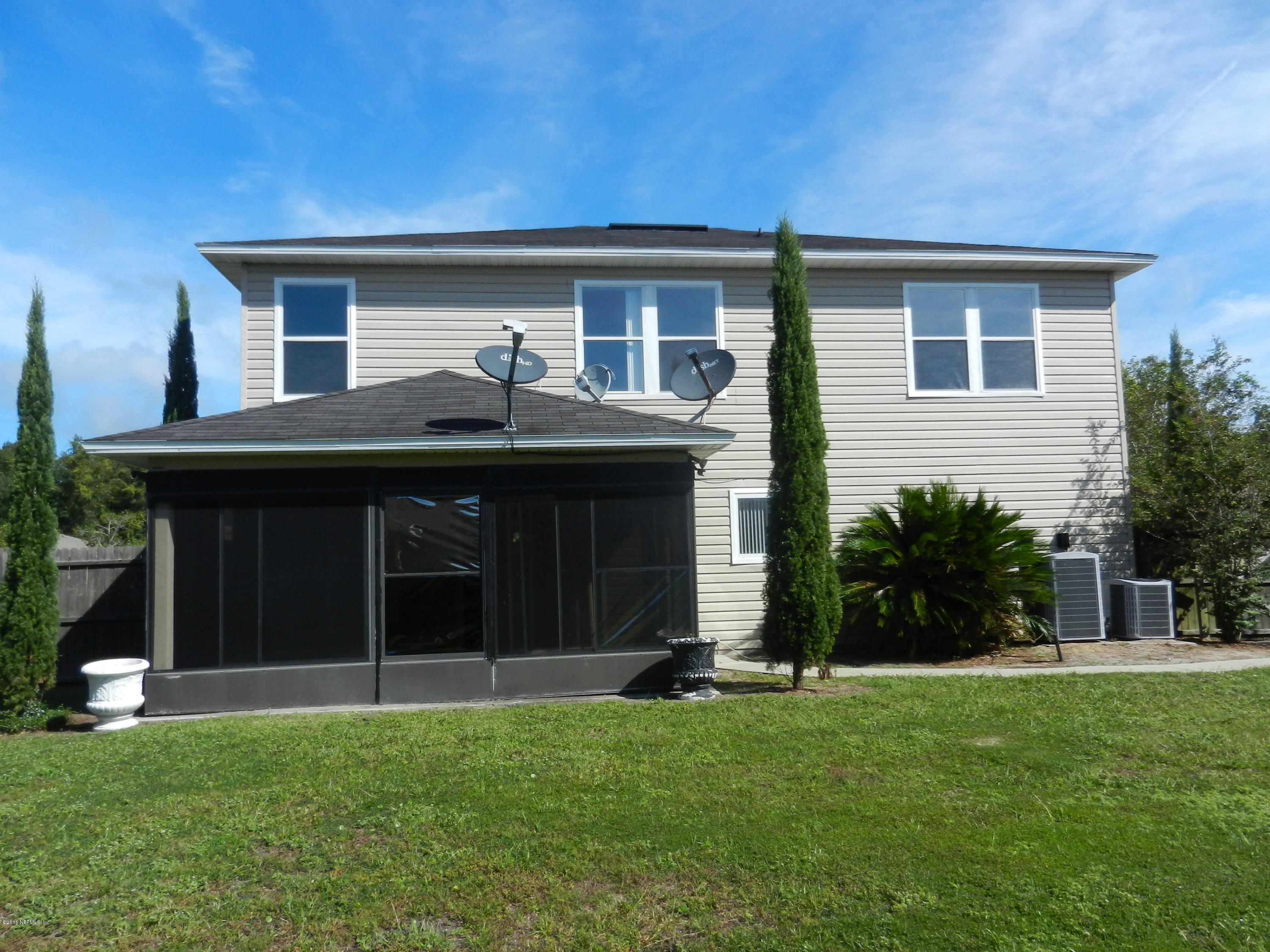86339 Cartesian Pointe Drive Yulee, FL 32097 - Photo 13 of 21 a house view with a garden space