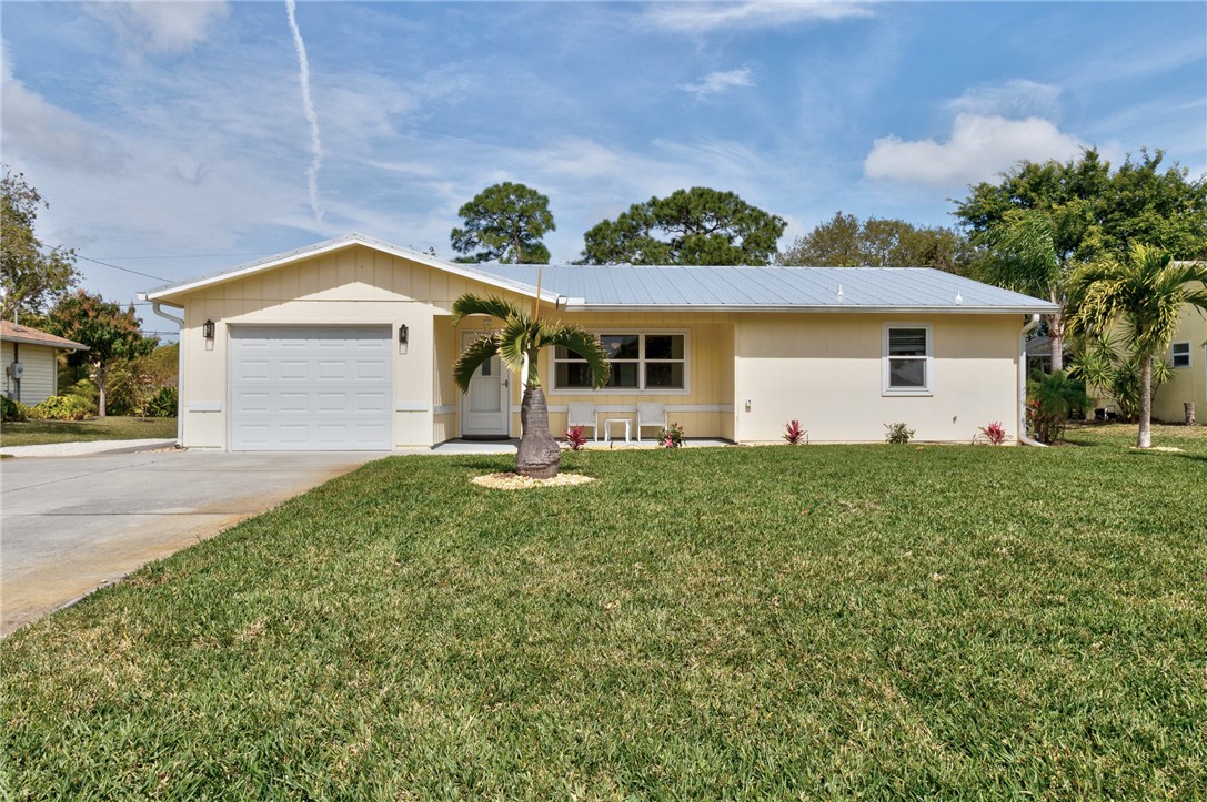 202 Delaware Avenue Sebastian, FL 32958 - Photo 1 of 34 a front view of house with yard and green space