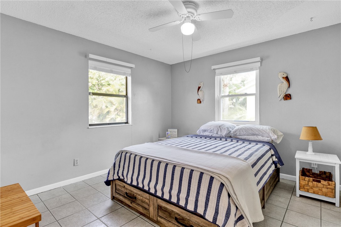 202 Delaware Avenue Sebastian, FL 32958 - Photo 17 of 34 a bedroom with a bed and a window
