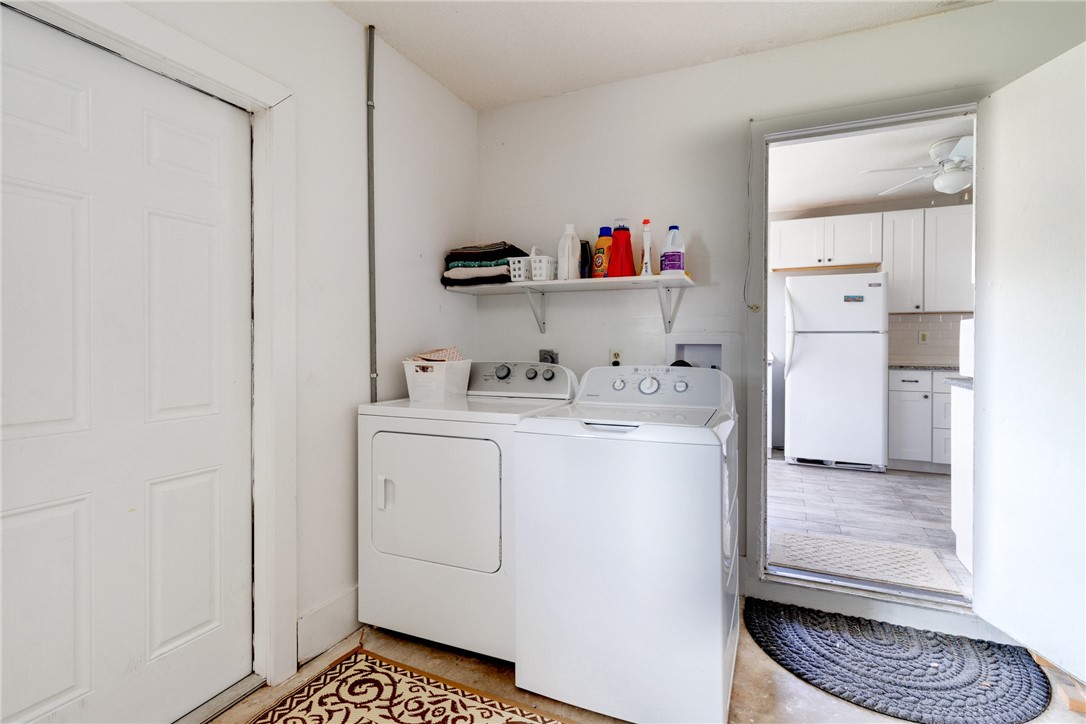 202 Delaware Avenue Sebastian, FL 32958 - Photo 20 of 34 a utility room with cabinets washer and dryer