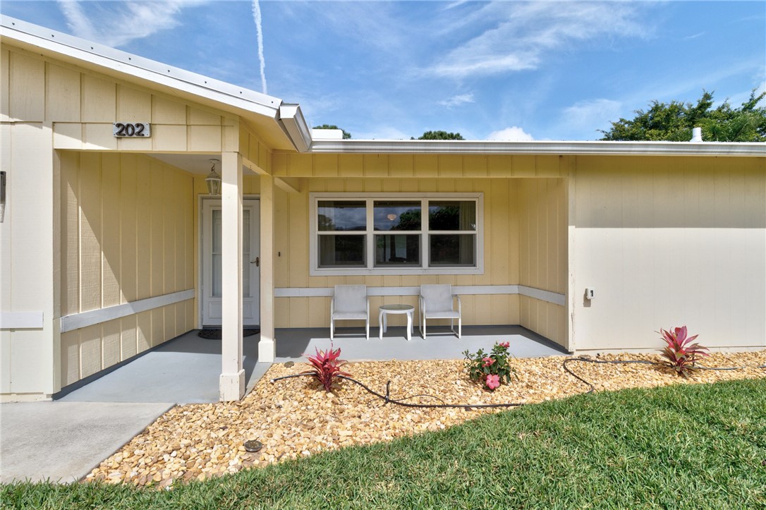 202 Delaware Avenue Sebastian, FL 32958 - Photo 2 of 34 a front view of a house with a yard
