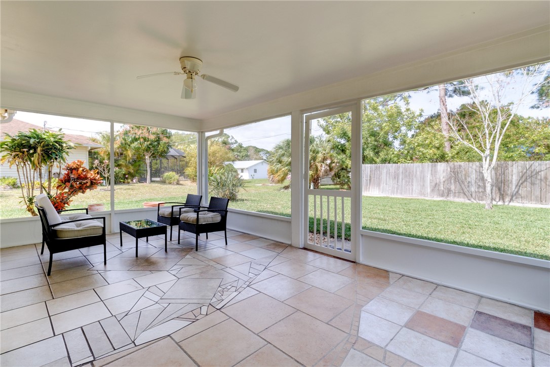 202 Delaware Avenue Sebastian, FL 32958 - Photo 21 of 34 a view of a porch with chairs and backyard