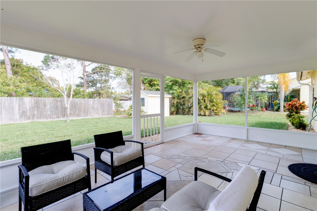 202 Delaware Avenue Sebastian, FL 32958 - Photo 23 of 34 a view of a patio with couches chairs and a yard