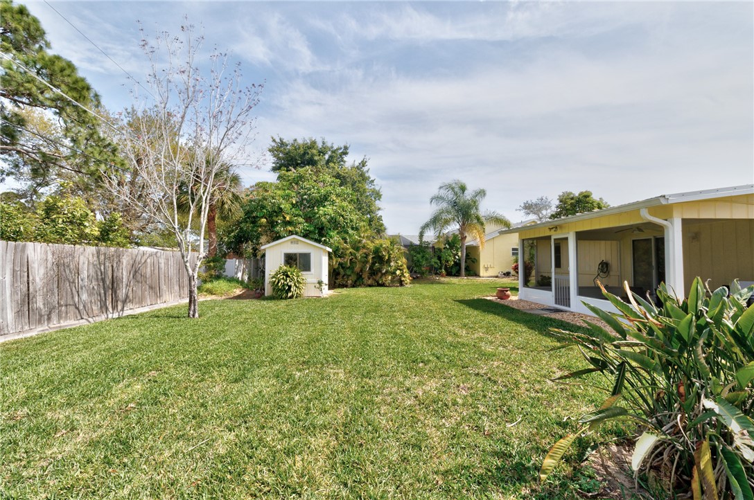 202 Delaware Avenue Sebastian, FL 32958 - Photo 25 of 34 a front view of a house with garden