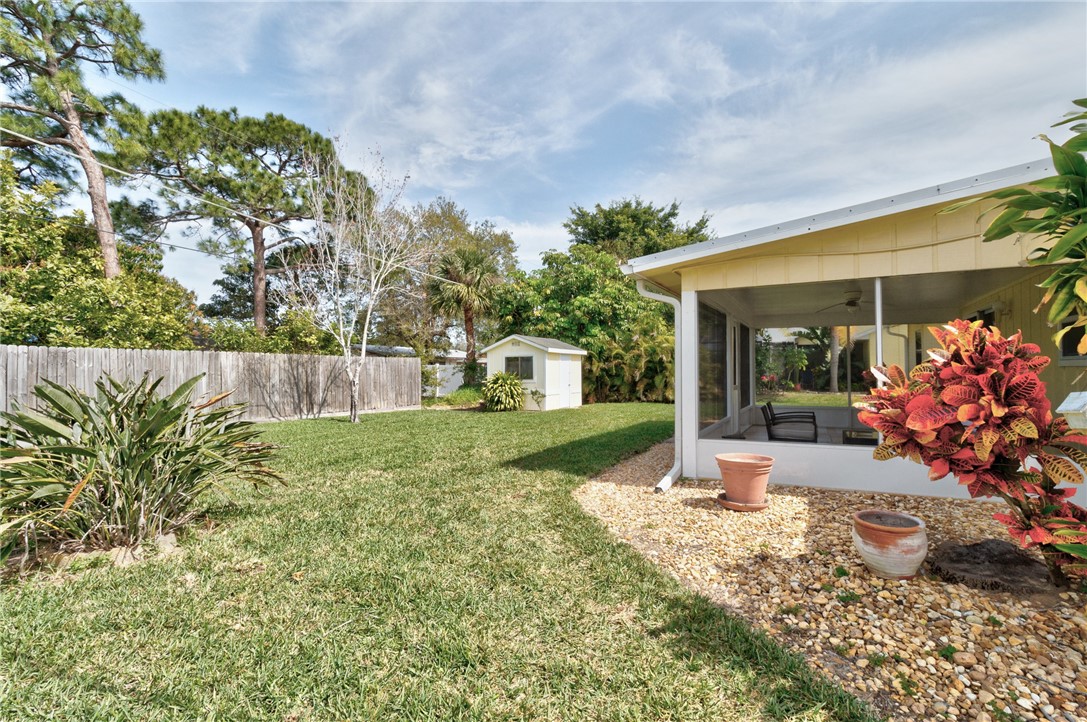 202 Delaware Avenue Sebastian, FL 32958 - Photo 26 of 34 a front view of a house with a yard garage and outdoor seating