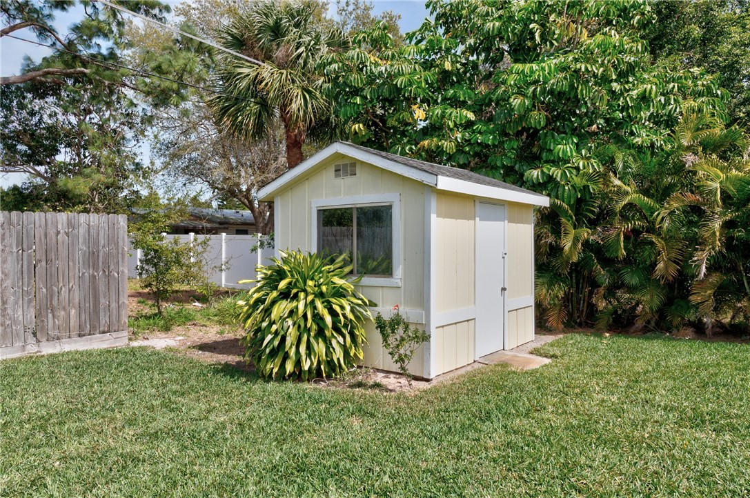 202 Delaware Avenue Sebastian, FL 32958 - Photo 29 of 34 a front view of house with a garden
