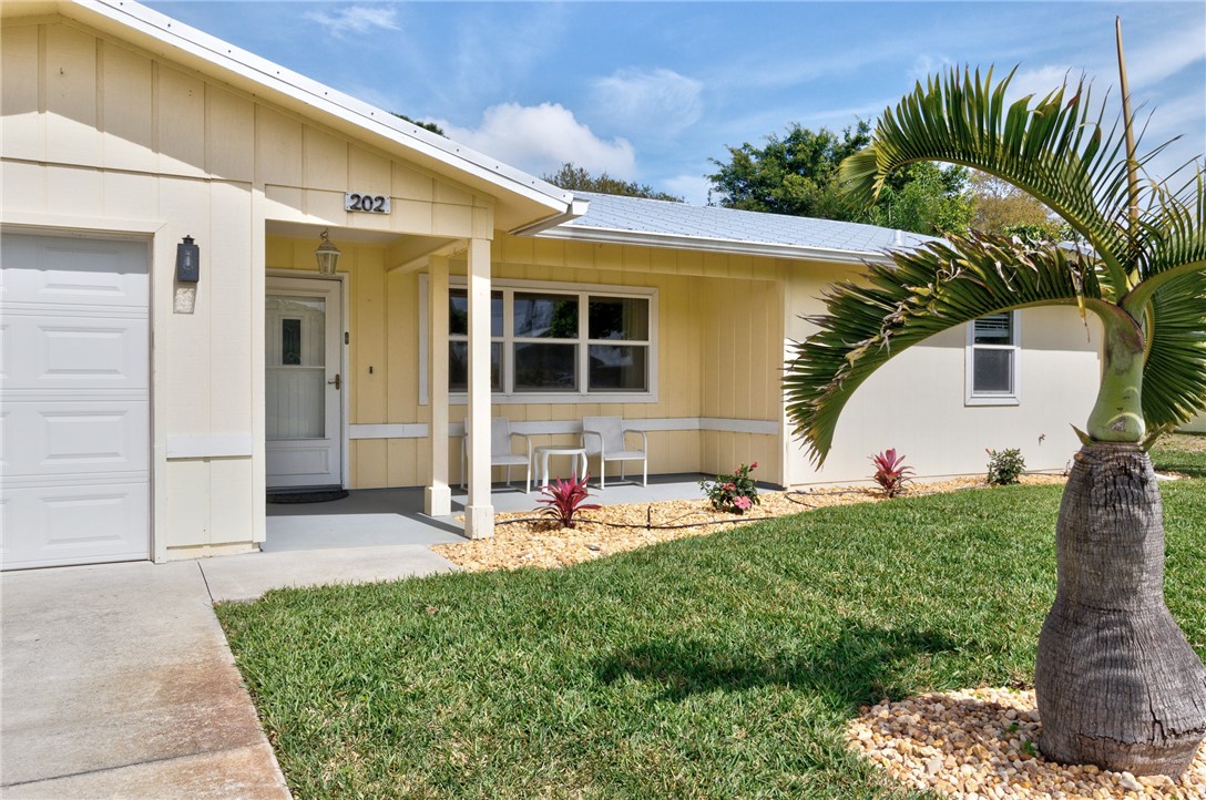 202 Delaware Avenue Sebastian, FL 32958 - Photo 3 of 34 a backyard of a house with outdoor seating