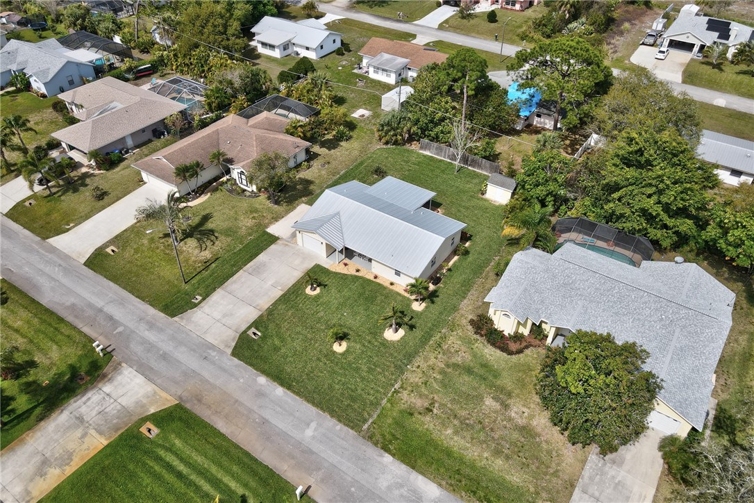 202 Delaware Avenue Sebastian, FL 32958 - Photo 32 of 34 an aerial view of a house with a garden and swimming pool