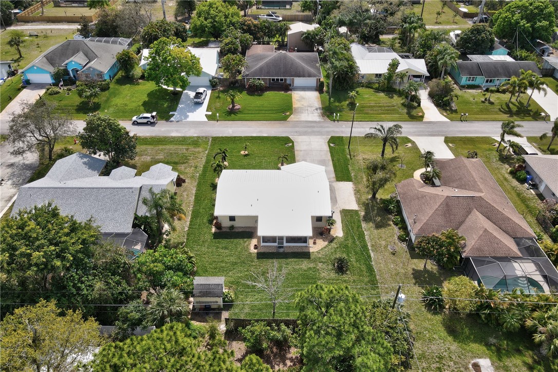 202 Delaware Avenue Sebastian, FL 32958 - Photo 34 of 34 an aerial view of multiple houses with yard