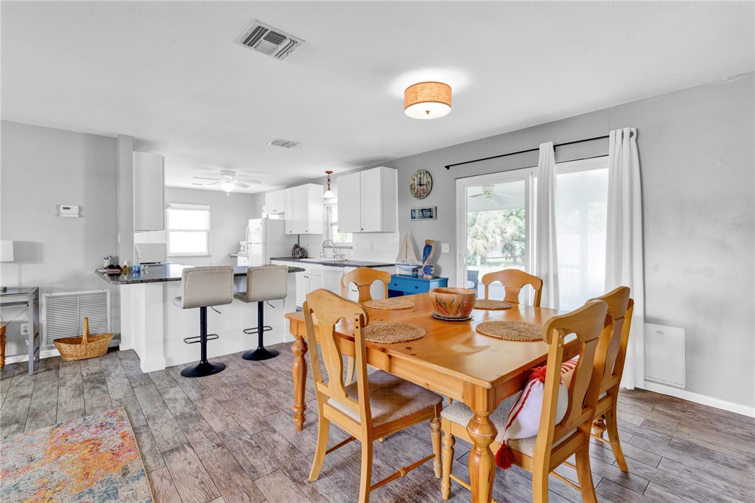 202 Delaware Avenue Sebastian, FL 32958 - Photo 7 of 34 a view of a dining room with furniture and a large window