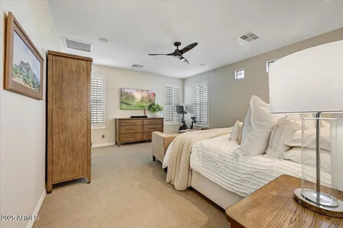 a bedroom with bed and window