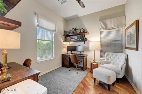 a living room with furniture a window and a table