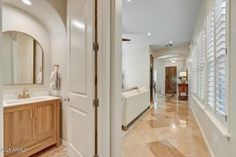 a bathroom with a double vanity sink and mirror