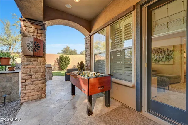 a outdoor space with the couches and dining table