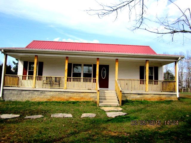 386 Union Road Shelbyville, TN 37160 - Photo 10 of 19 front porch 41X8 with natural pine posts and rails