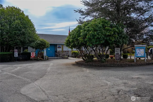 a view of a car park in front of house