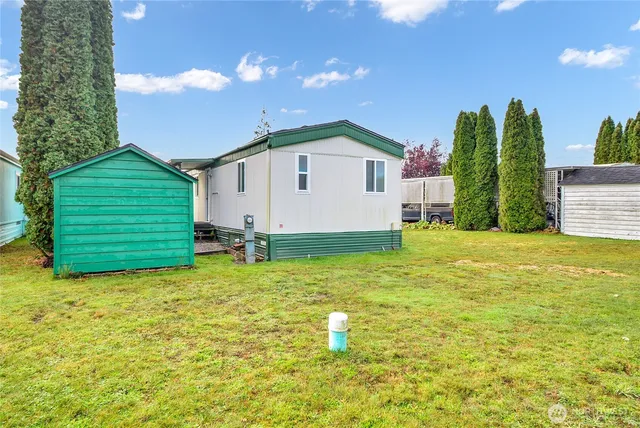 a view of a backyard of the house