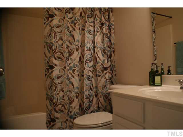 3413 Cathedral Bell Road Raleigh, NC 27614 - Photo 11 of 22 a bathroom with a sink and a mirror