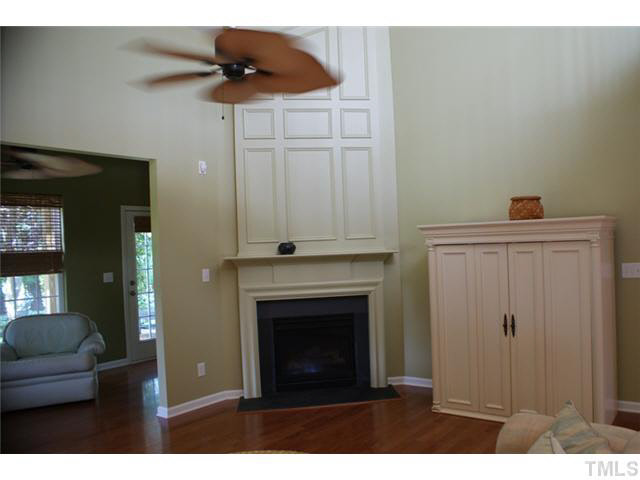 3413 Cathedral Bell Road Raleigh, NC 27614 - Photo 9 of 22 a living room with furniture and a fireplace