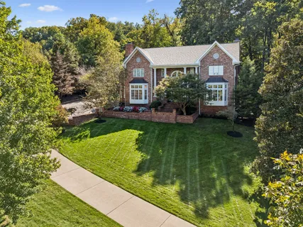a picture of flowers outside the house