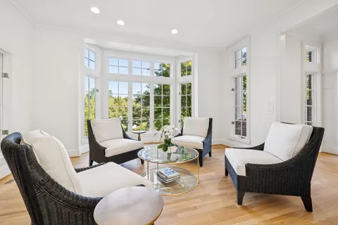 a white toilet sitting next to a shower