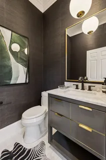 a spacious bathroom with a shower sink and mirror