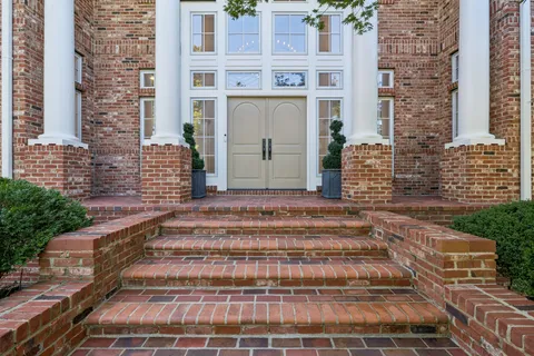 a large white bed in a white room