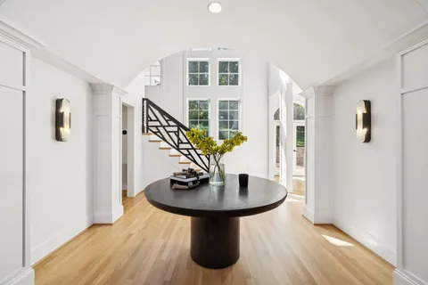 a living room with fireplace furniture and a flat screen tv