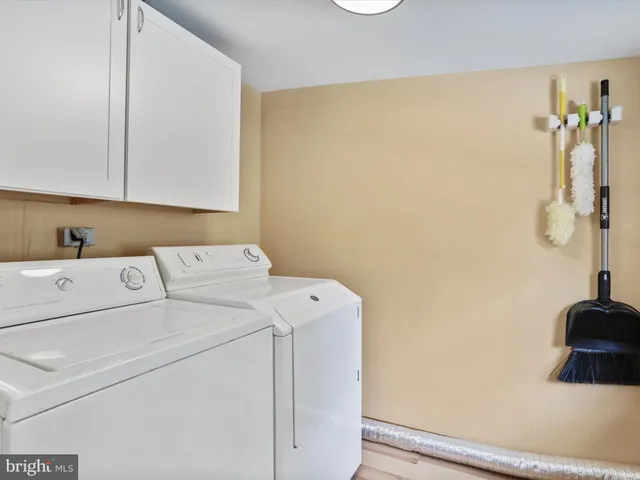 a room with books and shelf
