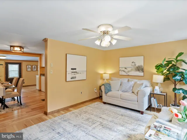 a bathroom with a sink a toilet and shower curtain
