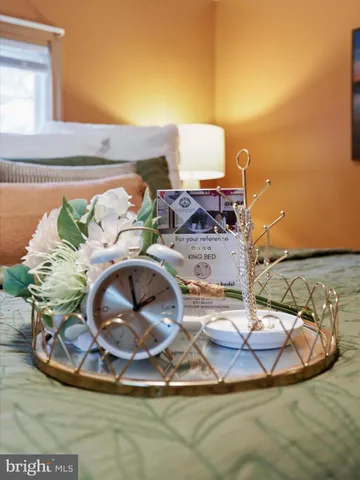 a view of a yard with plants and a tree