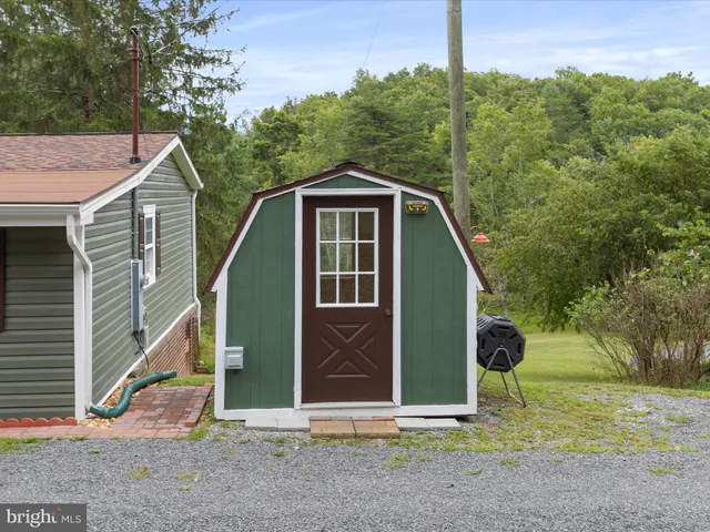 a view of a field with an outdoor space