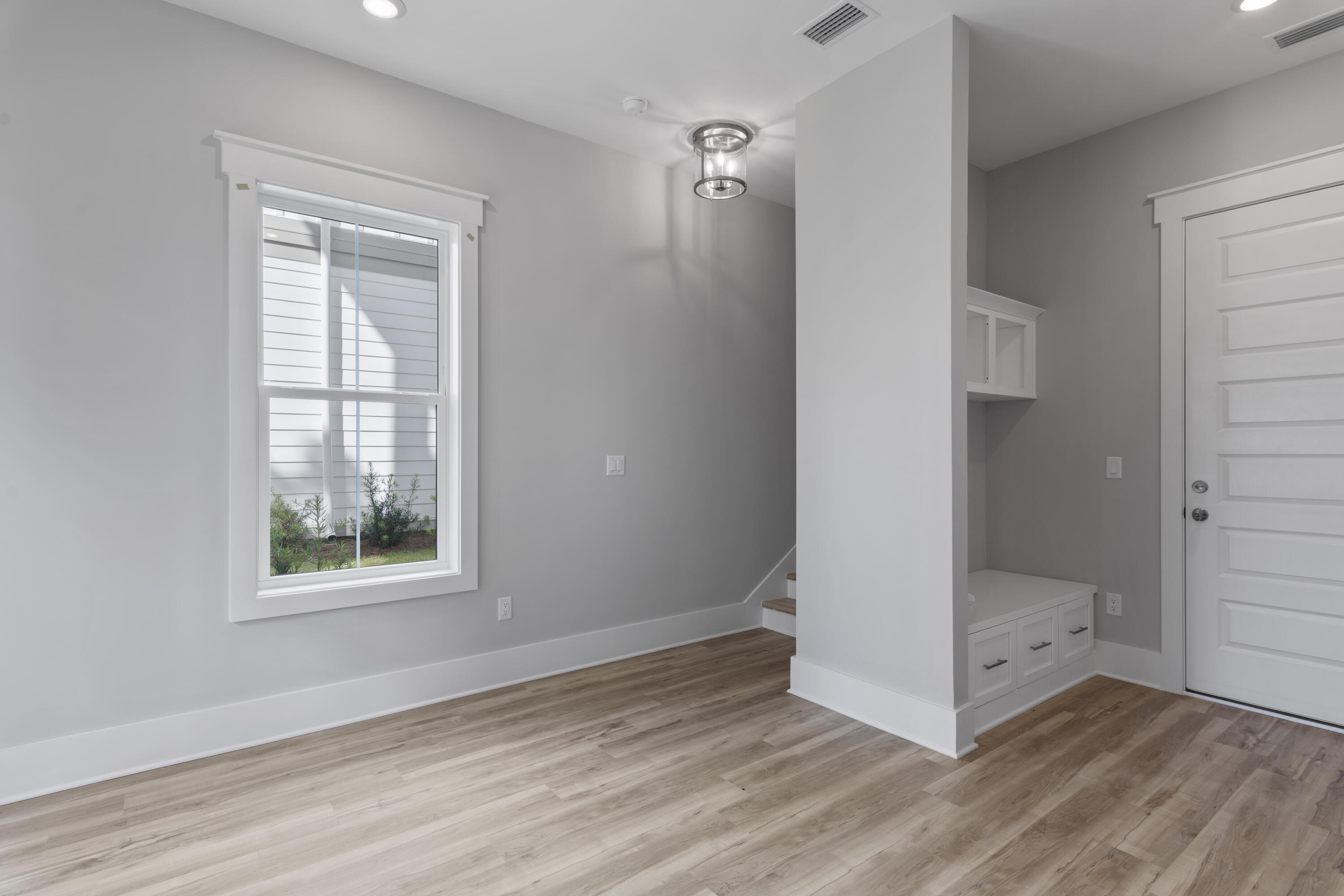 21 West Queen Palm Dr Inlet Beach Inlet Beach, FL 32461 - Photo 12 of 85 an empty room with wooden floor and windows