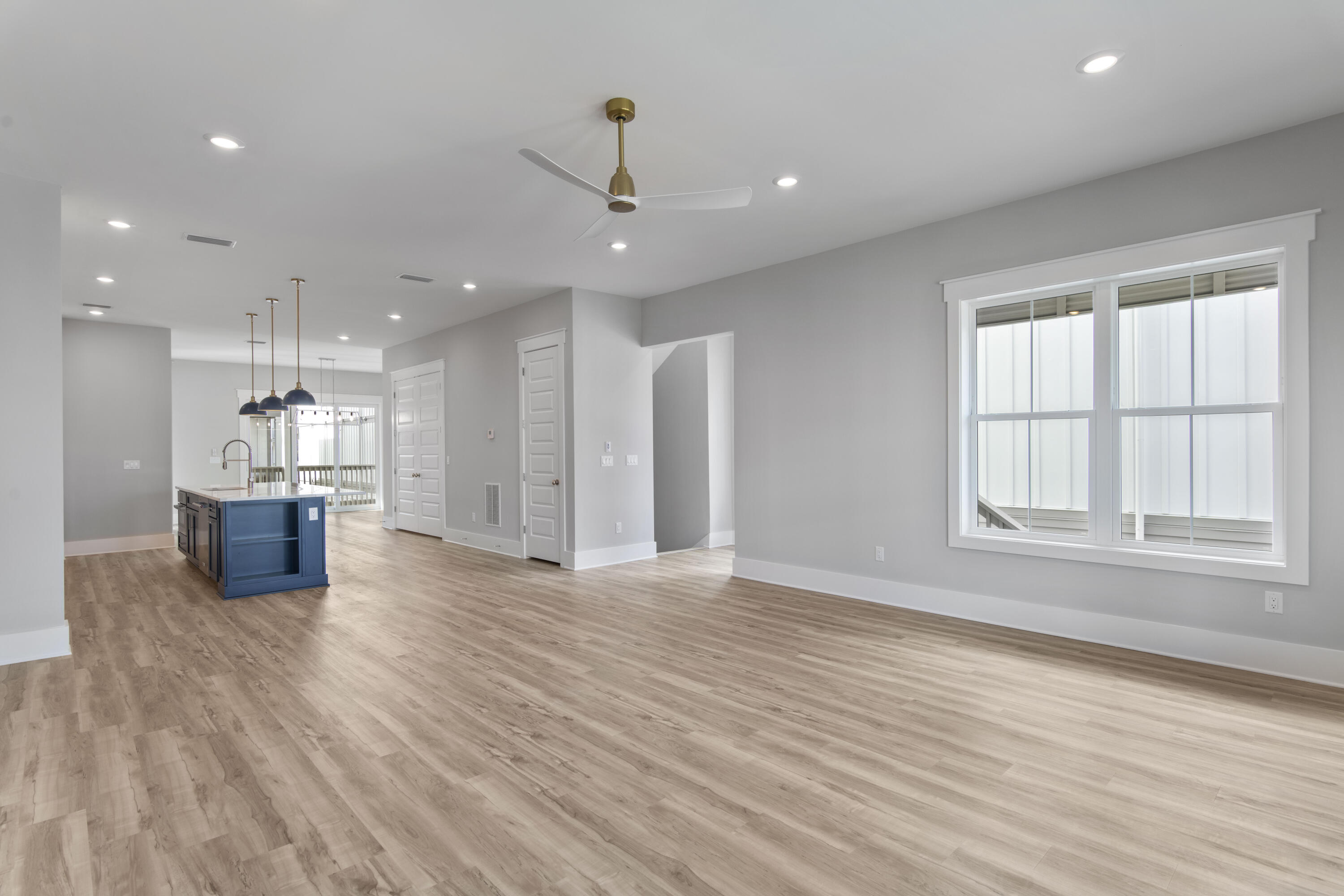 21 West Queen Palm Dr Inlet Beach Inlet Beach, FL 32461 - Photo 23 of 85 a view of an empty room with wooden floor and a window