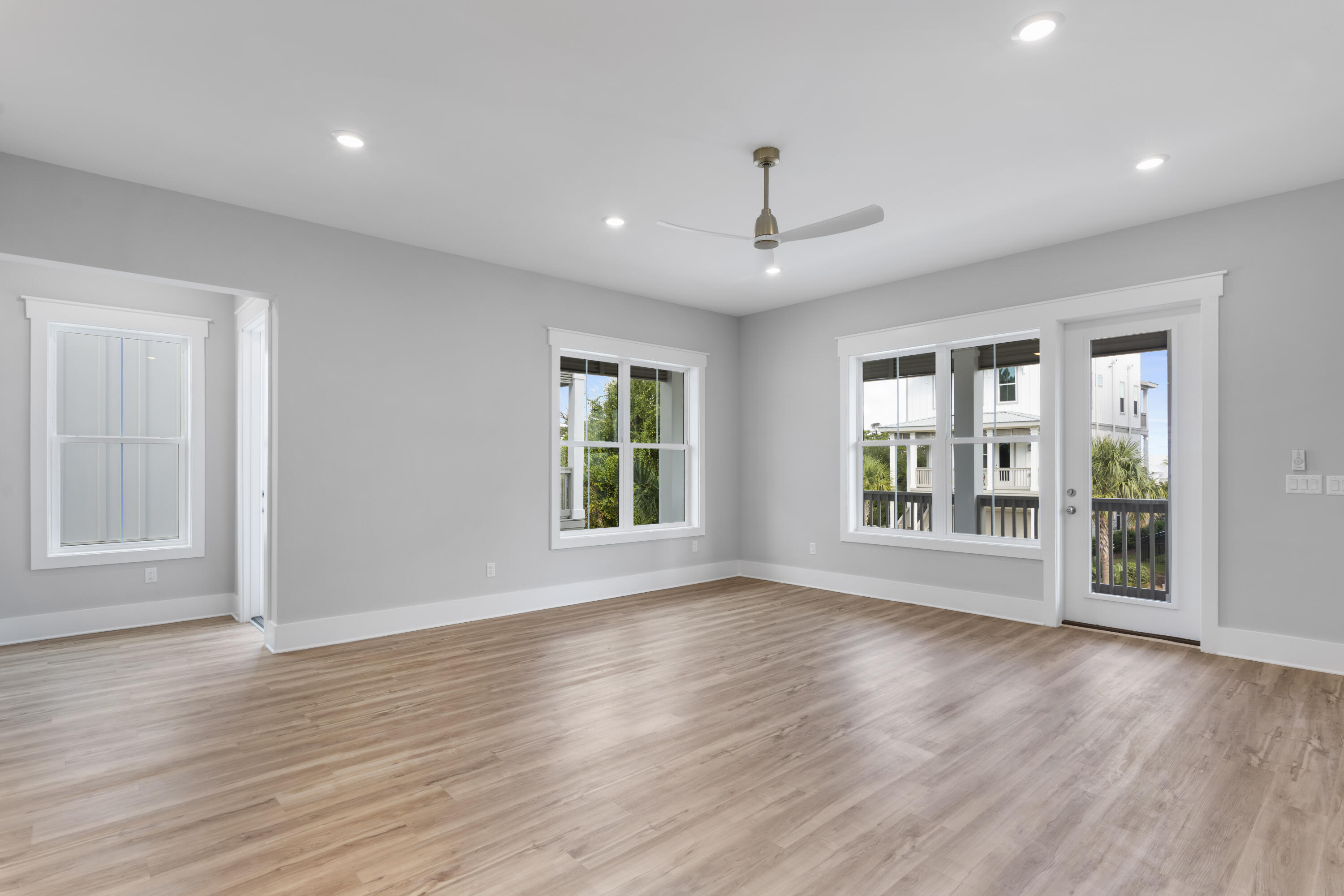 21 West Queen Palm Dr Inlet Beach Inlet Beach, FL 32461 - Photo 27 of 85 a view of an empty room with wooden floor and a window